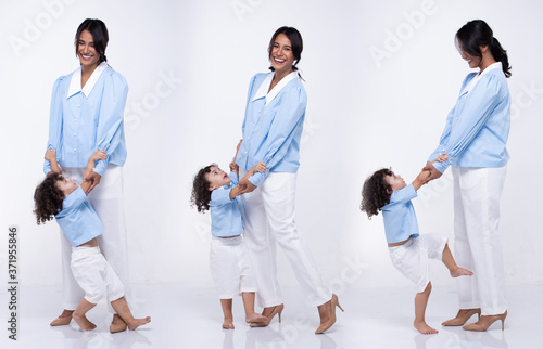 Asian Mother Caucasian Daughter Little girl hold mom hand and smile with love