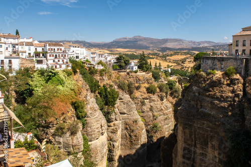 Ronda, Andalusian town situated atop spectacular deep gorge, with traditional white Spanish houses and steep cliffs, Spain.