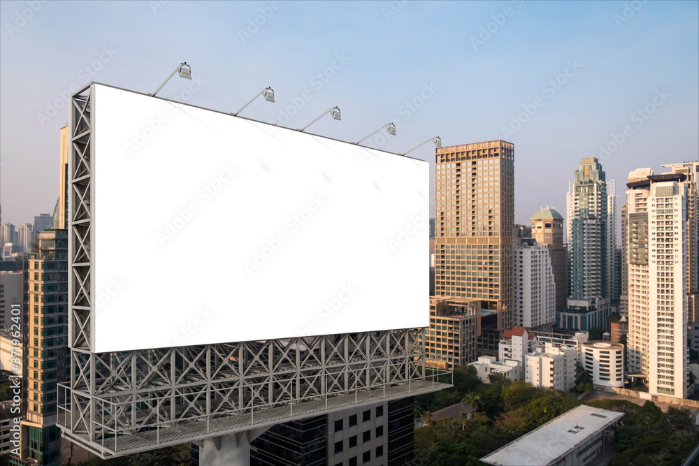 Blank white road billboard with Bangkok cityscape background at sunset. Street advertising poster, mock up, 3D rendering. Side view. The concept of marketing communication to promote or sell idea. Blank white road billboard with Bangkok cityscape background at sunset. Street advertising poster, mock up, 3D rendering. Side view. The concept of marketing communication to promote or sell idea.