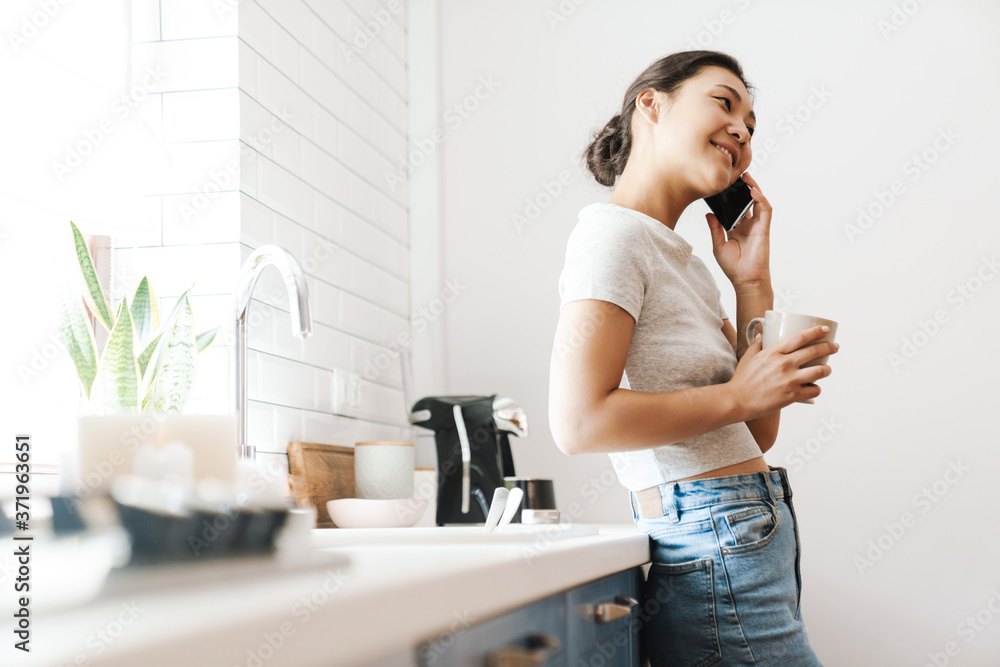 Young beautiful woman using cell phone Young beautiful woman using cell phone