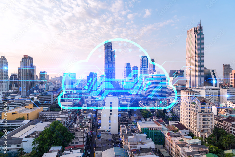 Glowing hologram of cloud icon, aerial panoramic cityscape of Bangkok at sunset. The concept of secure storage of digital data in Asia. Multi exposure.