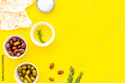 Fototapeta Naklejka Na Ścianę i Meble -  Italian olives, oil, bread - appetizer and snacks - top view copy space