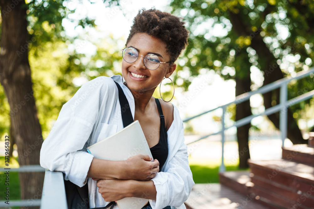 Attractive young african young student girl walking Attractive young african young student girl walking