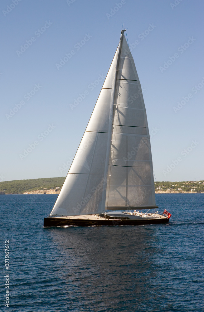 Luxury Sailing yacht. Sailing at Mediterranean Sea. Palma de Mallorca Spain. Full sail. Luxury Sailing yacht. Sailing at Mediterranean Sea. Palma de Mallorca Spain. Full sail.