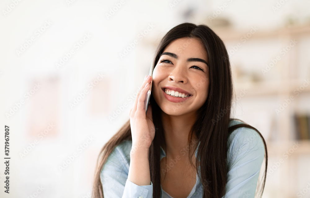 Pleasant Call. Closeup Portrait Of Joyful Asian Girl Talking On Cellphone Pleasant Call. Closeup Portrait Of Joyful Asian Girl Talking On Cellphone