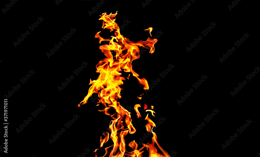 Fire flames on black background isolated. Burning gas or gasoline burns with fire and flames. Flaming burning sparks close-up, fire patterns. Infernal glow of fire in the dark with copy-space Fire flames on black background isolated. Burning gas or gasoline burns with fire and flames. Flaming burning sparks close-up, fire patterns. Infernal glow of fire in the dark with copy-space