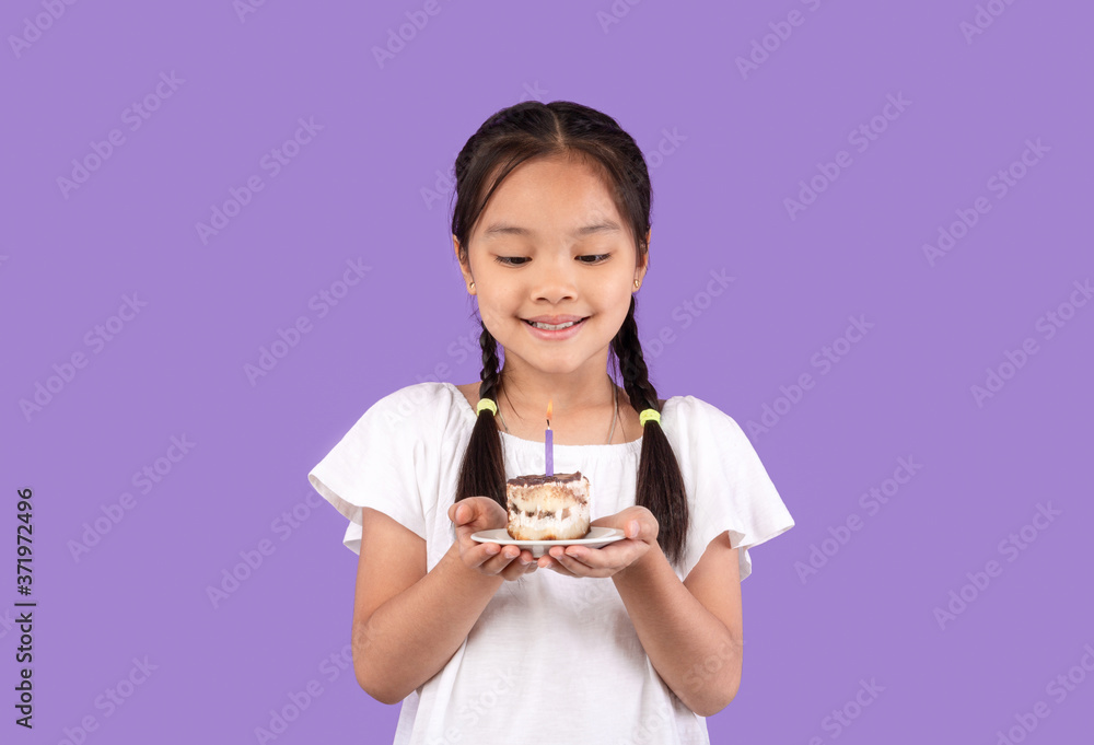 Cute Korean Girl Holding Birthday Cake Posing Over Purple Background Cute Korean Girl Holding Birthday Cake Posing Over Purple Background