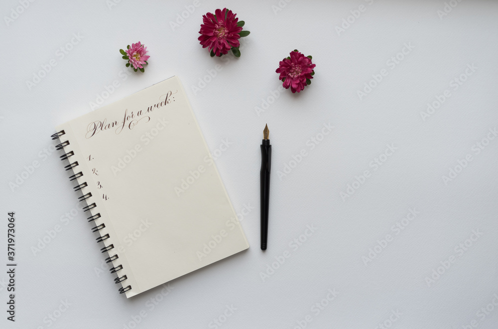 notebook with pink flowers, notebook with title plan for a week notebook with pink flowers, notebook with title plan for a week