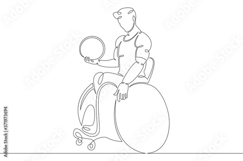 disabled man athlete in a wheelchair with a ball in his hand. Paralympic sport basketball volleyball photo