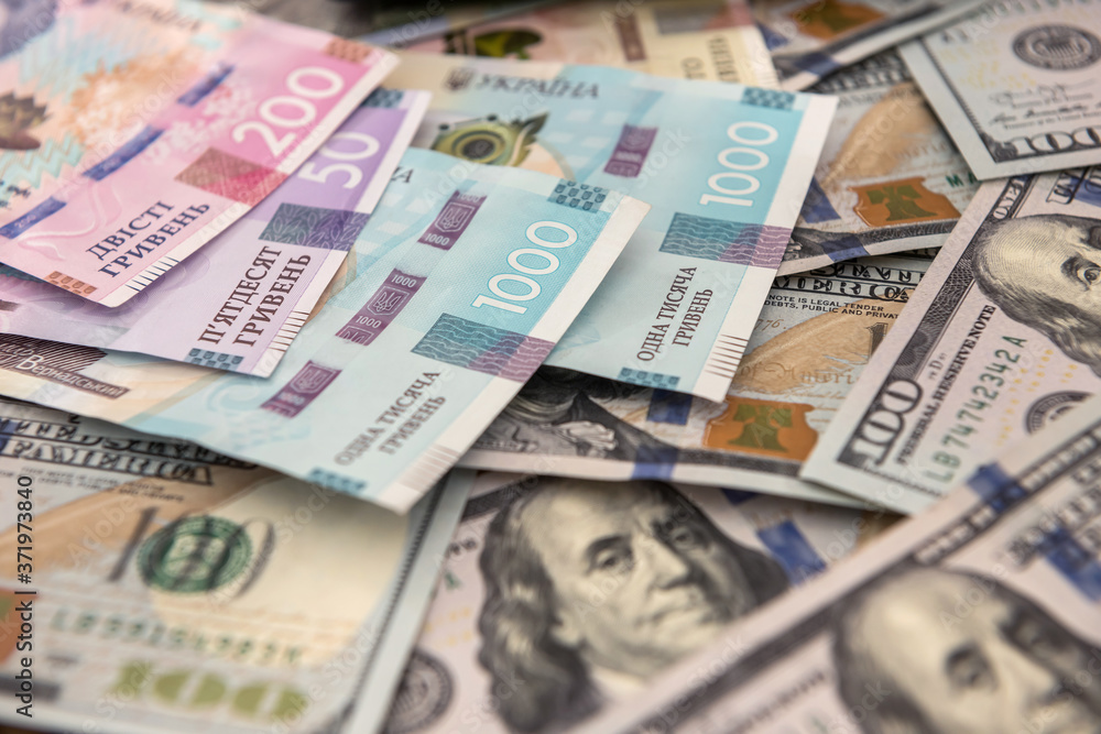 money concept exchange. dolla to uah gryvna bills money concept exchange. dolla to uah gryvna bills