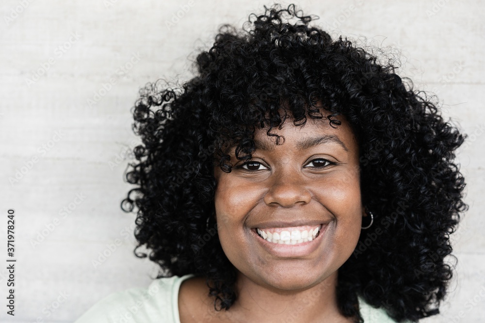 Young curvy african girl having fun smiling on camera - Lifestyle concept - Focus on face Young curvy african girl having fun smiling on camera - Lifestyle concept - Focus on face