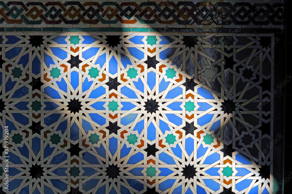 Tiles of Al Andalus Alcazar of Seville Spain. Play of light and shadow in architecture. Arab pattern decoration