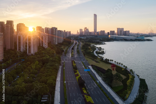 Sunrise with CBD buildings by Jinji Lake in Suzhou, China.