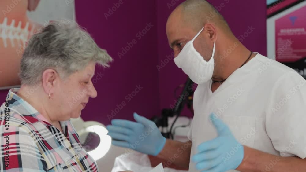 Male doctor talking to an elderly woman. Male doctor talking to an elderly woman.