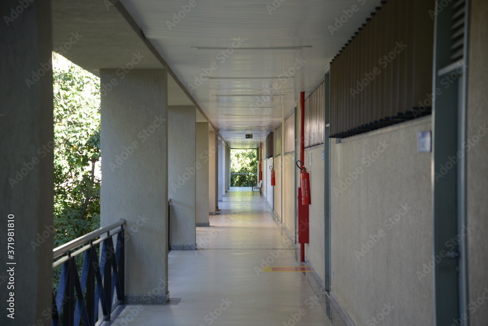 an open corridor and some trees 