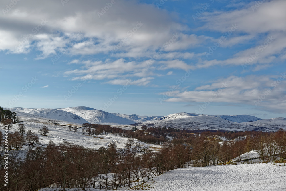Looking over the Valley's of Glen Esk and Glen Clova, on a cold Afternoon in February under a light Blue Sky with White Clouds.
