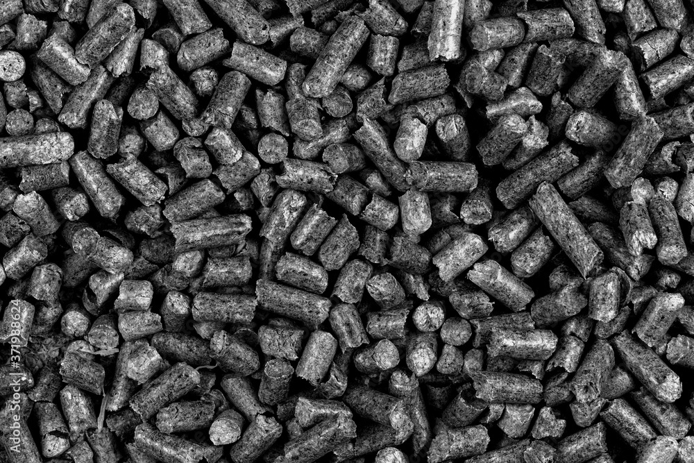 White and black wood pellets texture background. natural pile of wood pellets. organic biofuels