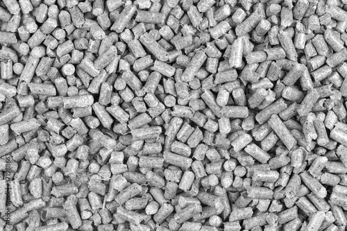 White and black wood pellets texture background. natural pile of wood pellets. organic biofuels. Alternative biofuel from sawdust.
 pile of compressed wood pellets