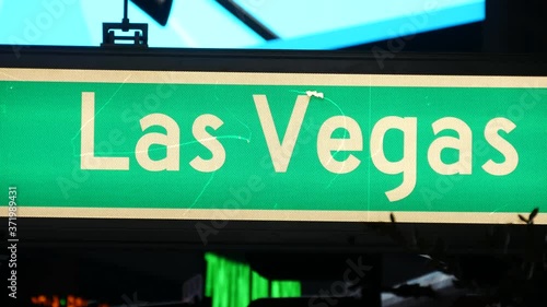 Fabulos Las Vegas, traffic sign glowing on The Strip in sin city of USA. Iconic signboard on the road to Fremont street in Nevada. Illuminated symbol of casino money playing and bets in gaming area.