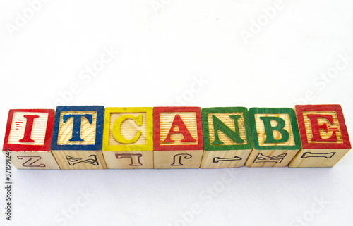 The term itcanbe visually displayed on a clear background using colored wooden blocks image with copy space in horizontal format photo