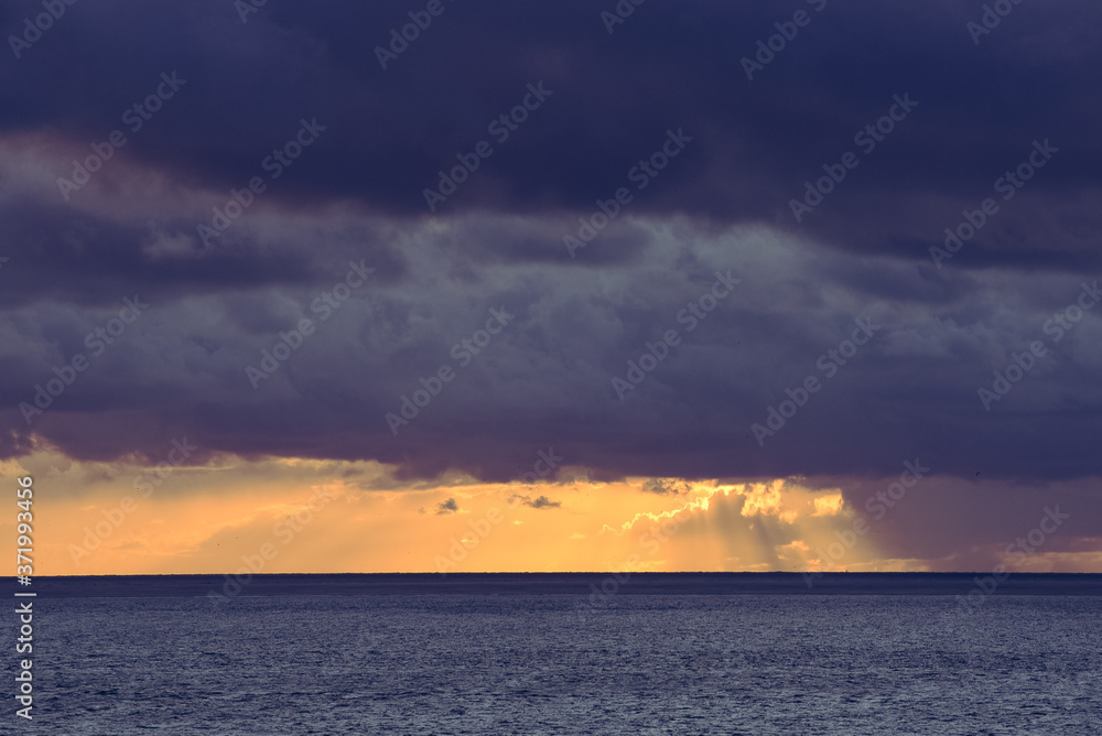 Naklejka premium Every cloud has a sliverlining. Sunset near Huisduinen, Den Helder
