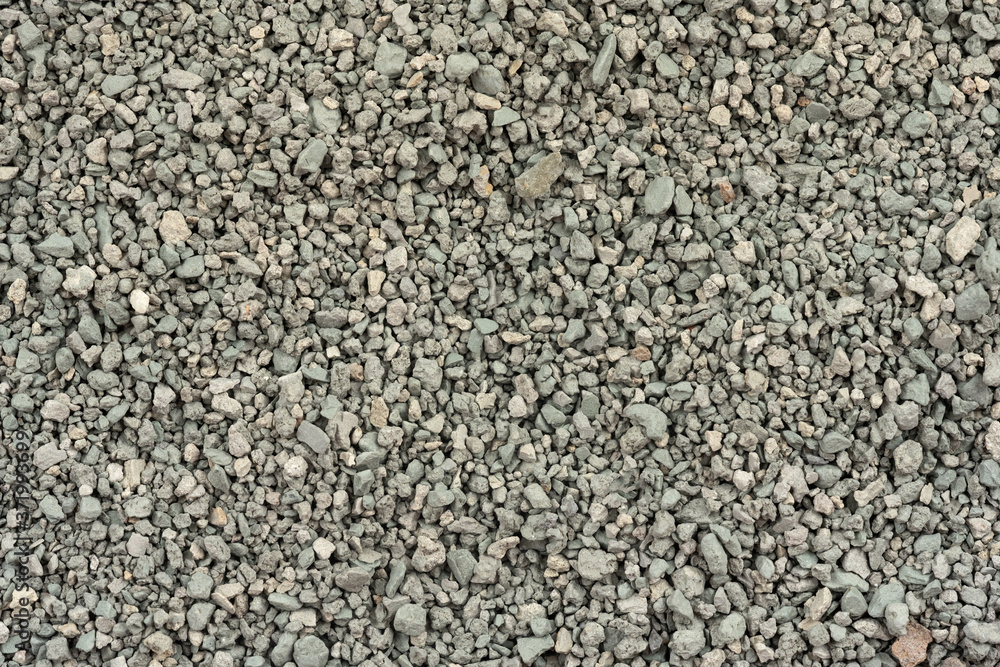 Gray small rocks ground texture. black small road stone background. gravel pebbles stone seamless texture. dark background of crushed granite gravel, close up. clumping clay Gray small rocks ground texture. black small road stone background. gravel pebbles stone seamless texture. dark background of crushed granite gravel, close up. clumping clay
