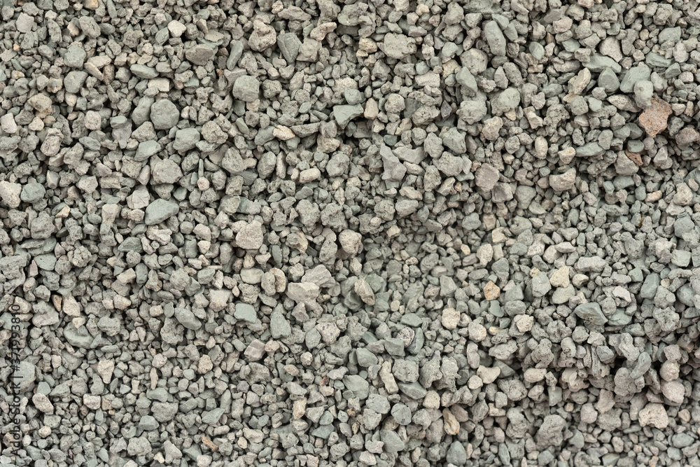 Gray small rocks ground texture. black small road stone background. gravel pebbles stone seamless texture. dark background of crushed granite gravel, close up. clumping clay Gray small rocks ground texture. black small road stone background. gravel pebbles stone seamless texture. dark background of crushed granite gravel, close up. clumping clay