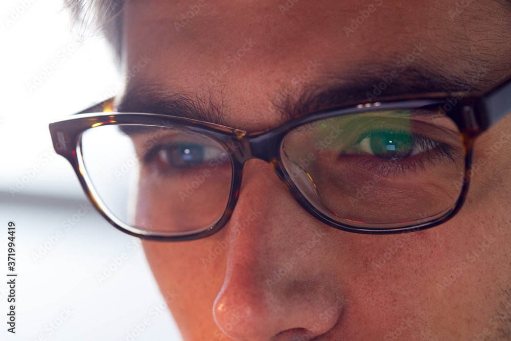 Close Up Of Businessman Wearing Glasses Looking At Computer Screen Close Up Of Businessman Wearing Glasses Looking At Computer Screen