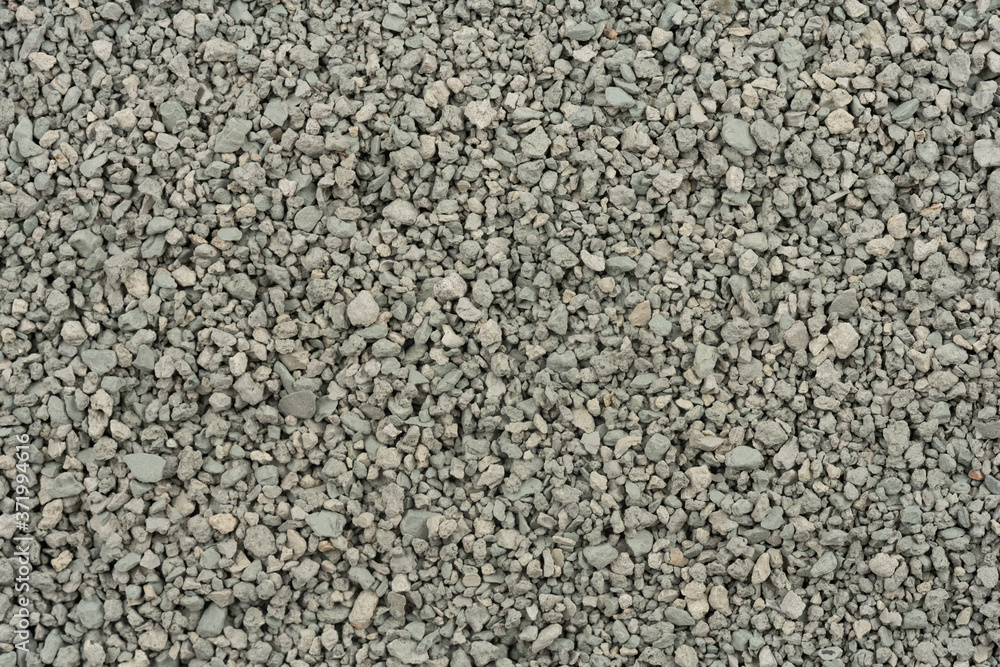 Gray small rocks ground texture. black small road stone background. gravel pebbles stone seamless texture. dark background of crushed granite gravel, close up. clumping clay Gray small rocks ground texture. black small road stone background. gravel pebbles stone seamless texture. dark background of crushed granite gravel, close up. clumping clay