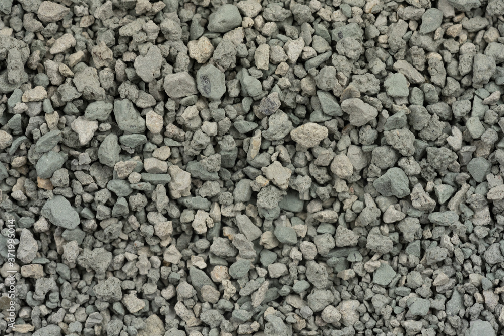 Gray small rocks ground texture. black small road stone background. gravel pebbles stone seamless texture. dark background of crushed granite gravel, close up. clumping clay Gray small rocks ground texture. black small road stone background. gravel pebbles stone seamless texture. dark background of crushed granite gravel, close up. clumping clay