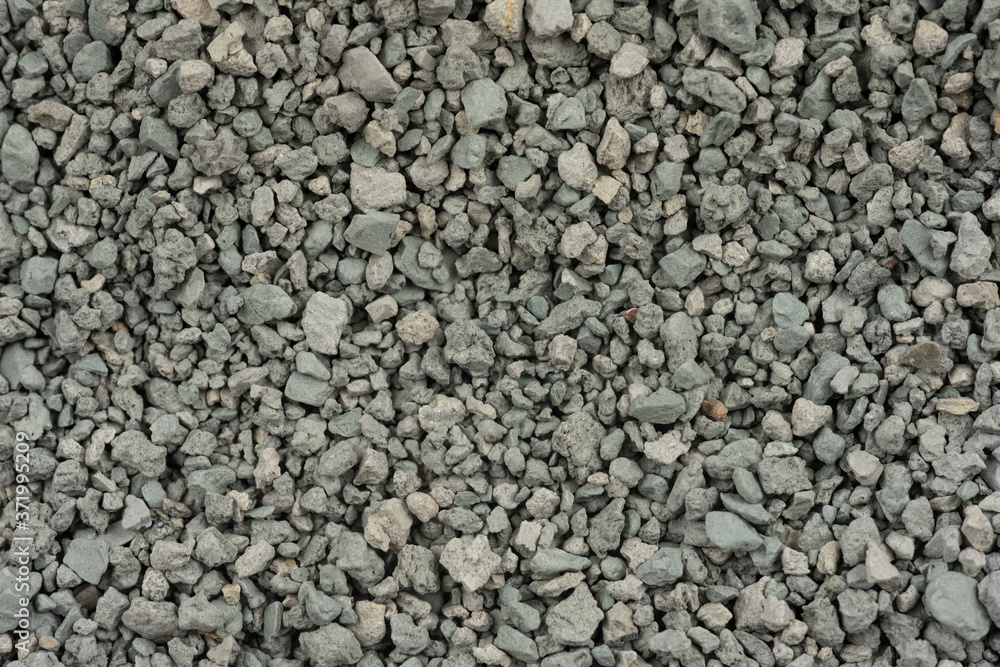 Gray small rocks ground texture. black small road stone background. gravel pebbles stone seamless texture. dark background of crushed granite gravel, close up. clumping clay Gray small rocks ground texture. black small road stone background. gravel pebbles stone seamless texture. dark background of crushed granite gravel, close up. clumping clay