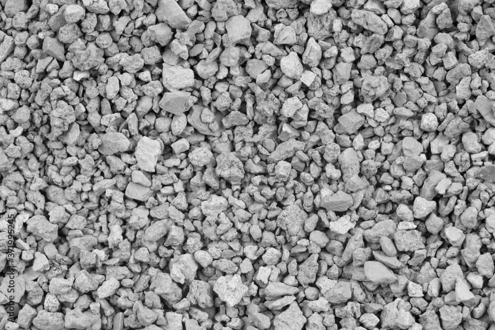 Gray small rocks ground texture. black small road stone background. gravel pebbles stone seamless texture. dark background of crushed granite gravel, close up. clumping clay Gray small rocks ground texture. black small road stone background. gravel pebbles stone seamless texture. dark background of crushed granite gravel, close up. clumping clay