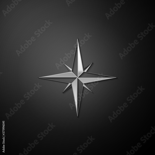 Silver Wind rose icon isolated on black background. Compass icon for travel. Navigation design. Long shadow style. Vector.
