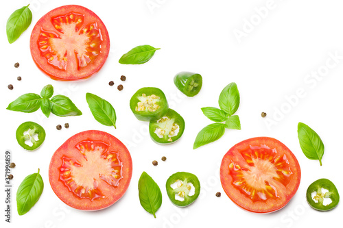 fresh tomato slices with green pepper and basil leaves isolated on white background. top view