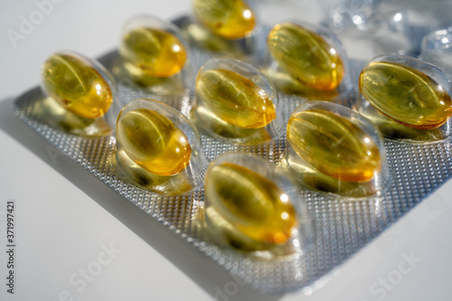Close-up of gelatinous capsules with the cod-liver oil-omega3 in blister. Selective focus. High quality photo