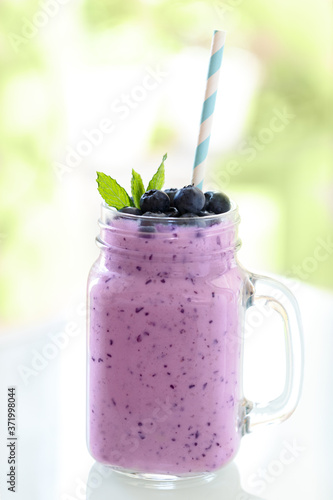 Blueberry smoothie in a glass jar
