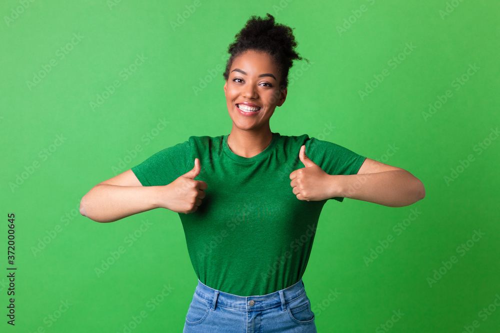 Afro lady showing thumb up and smiling