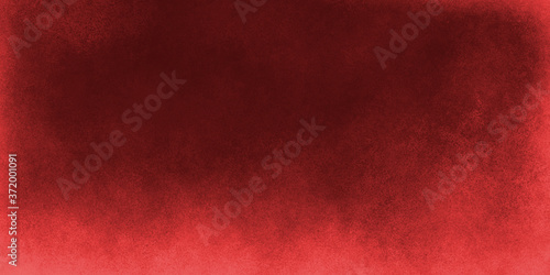 a bright red abstract grunge background with a bright red around the edges and dark in the middle. Shabby, textured, grainy background with a mix of different shades of red