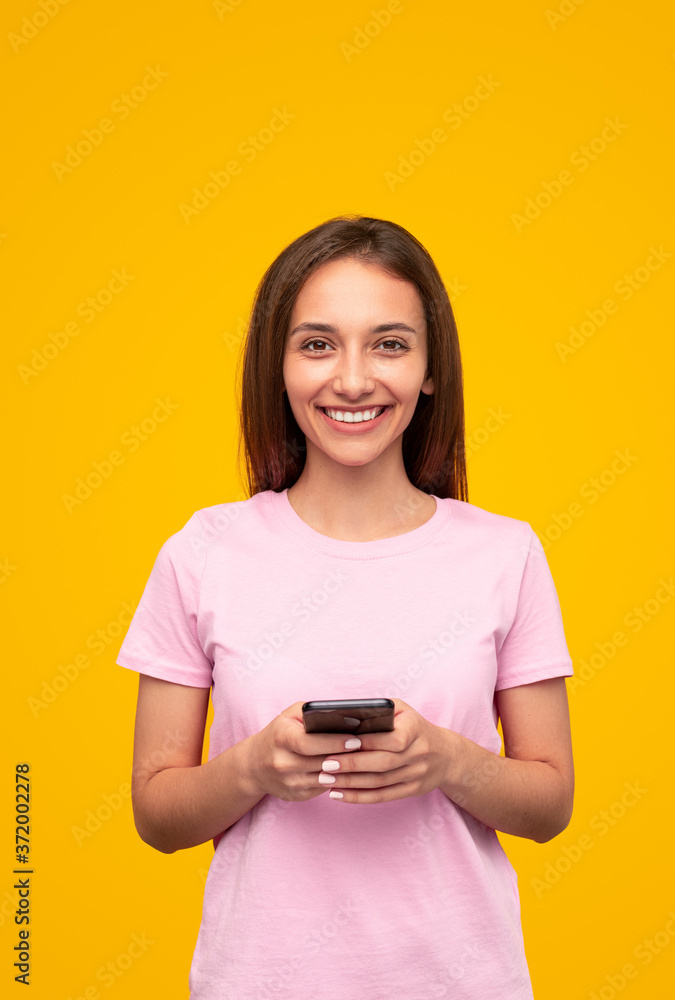 Happy female student using smartphone Happy female student using smartphone