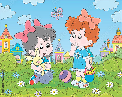 Cute little girls playing w...
