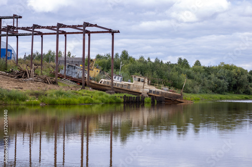 Old abandoned boat on the river. Old passenger boat.