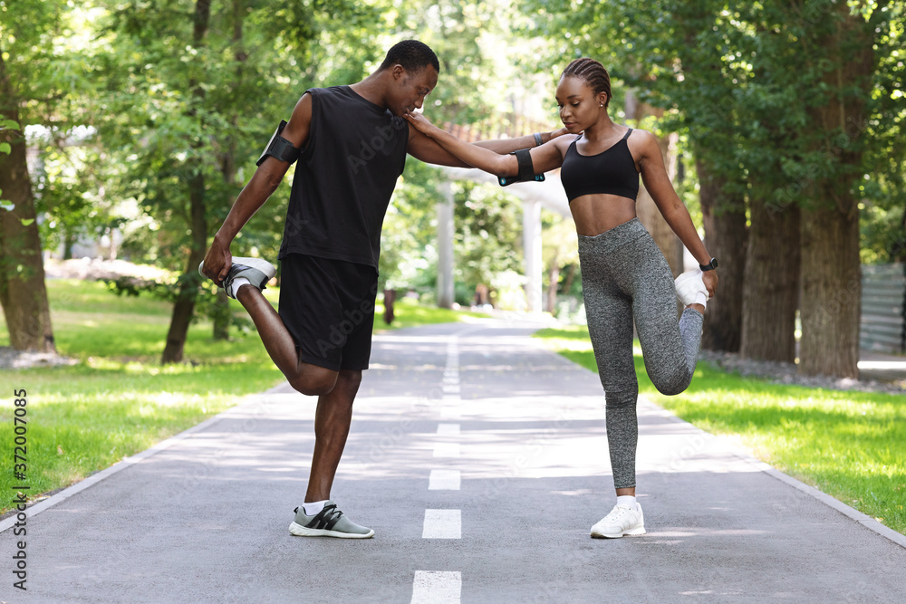 Couple Workout. Fit African Couple Doing Fitness Training Together In City Park Couple Workout. Fit African Couple Doing Fitness Training Together In City Park