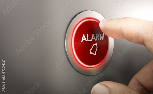 Fotografija Man pressing a red security alarm button.