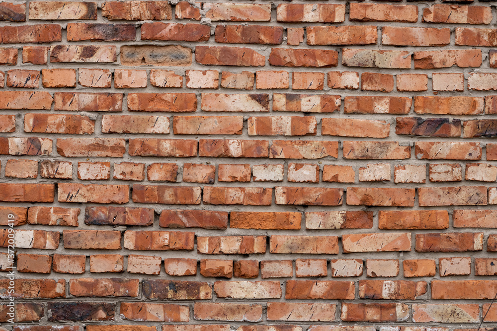 Wall of red bricks. Texture or background of bricks. Wall of red bricks. Texture or background of bricks.