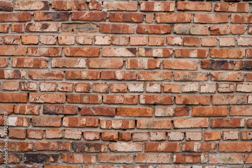 Wall of red bricks. Texture or background of bricks.