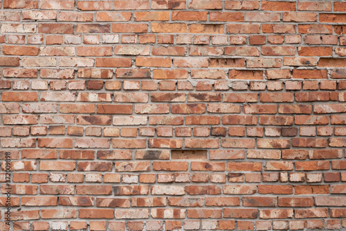 Wall of red bricks. Texture or background of bricks.