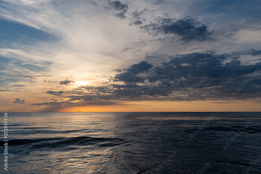 Morning sunrise and waves at the beach