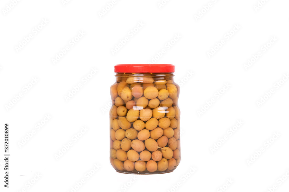 Small green olives in glass jar isolated Small green olives in glass jar isolated