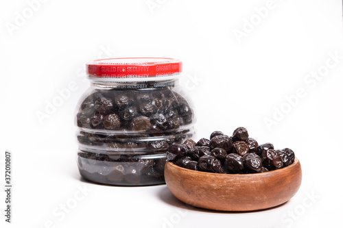 black olives in plastic jar isolated