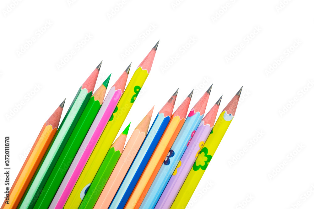 Some different colored wood pencil crayons placed on a white background